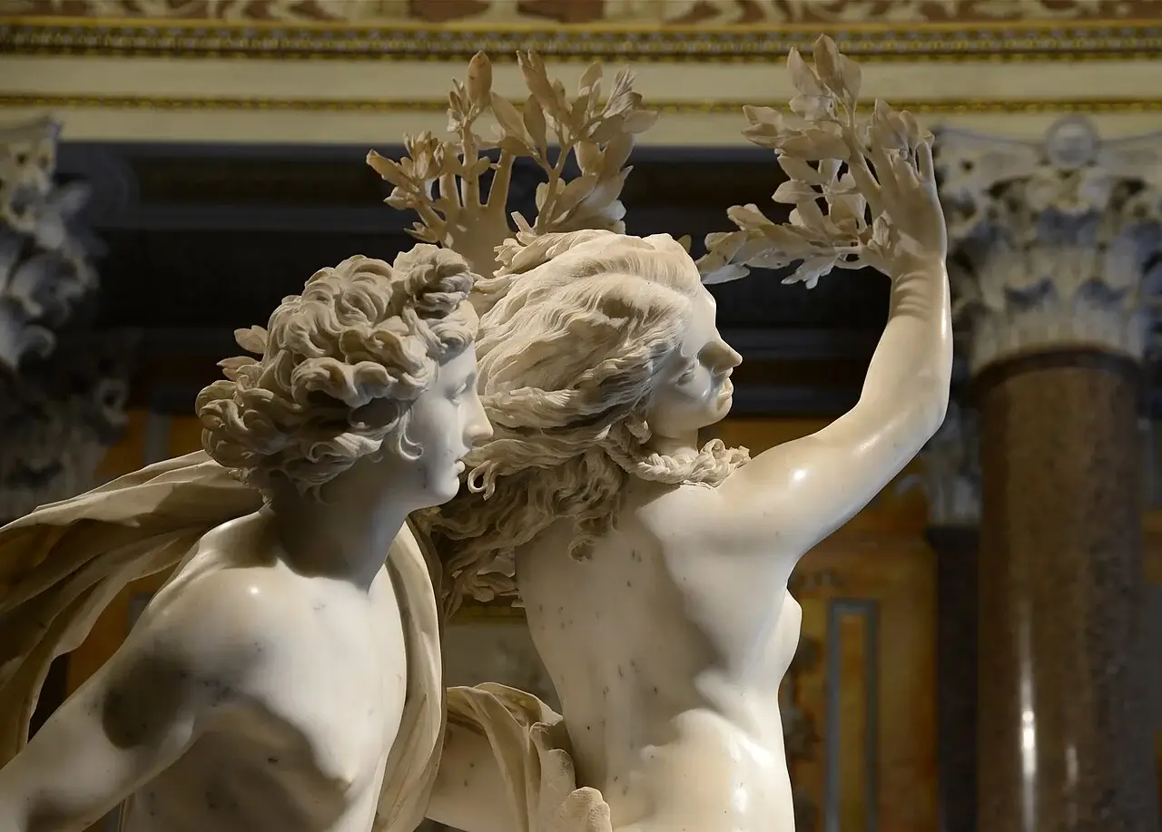 Apollo and Daphne marble sculpture by Gian Lorenzo Bernini depicting the moment Apollo transforms Daphne into a laurel tree from Greek mythology.